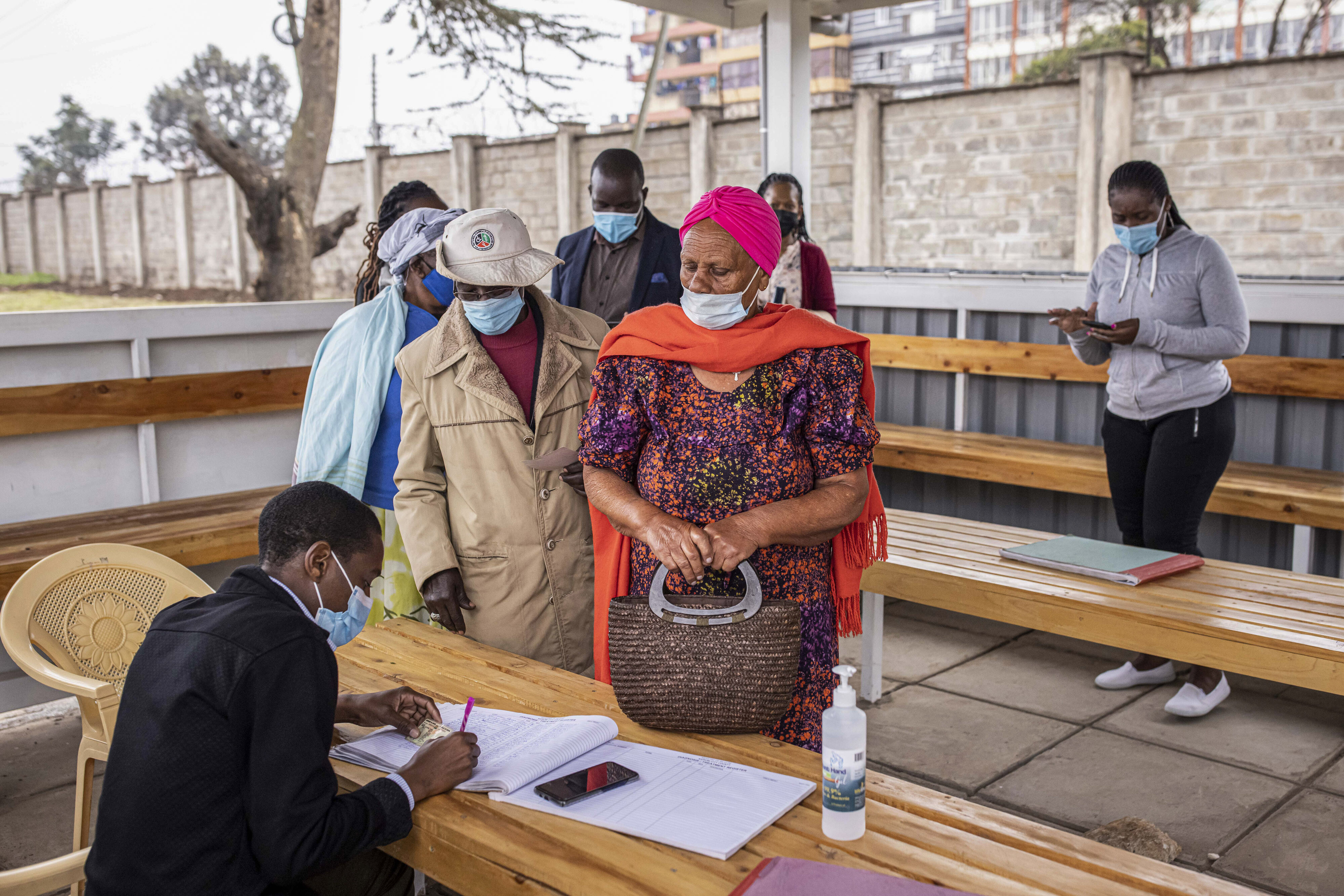 Residents wait in line to register for the AstraZeneca Covid-19 vaccine at Mbagathi Hospital in Nairobi