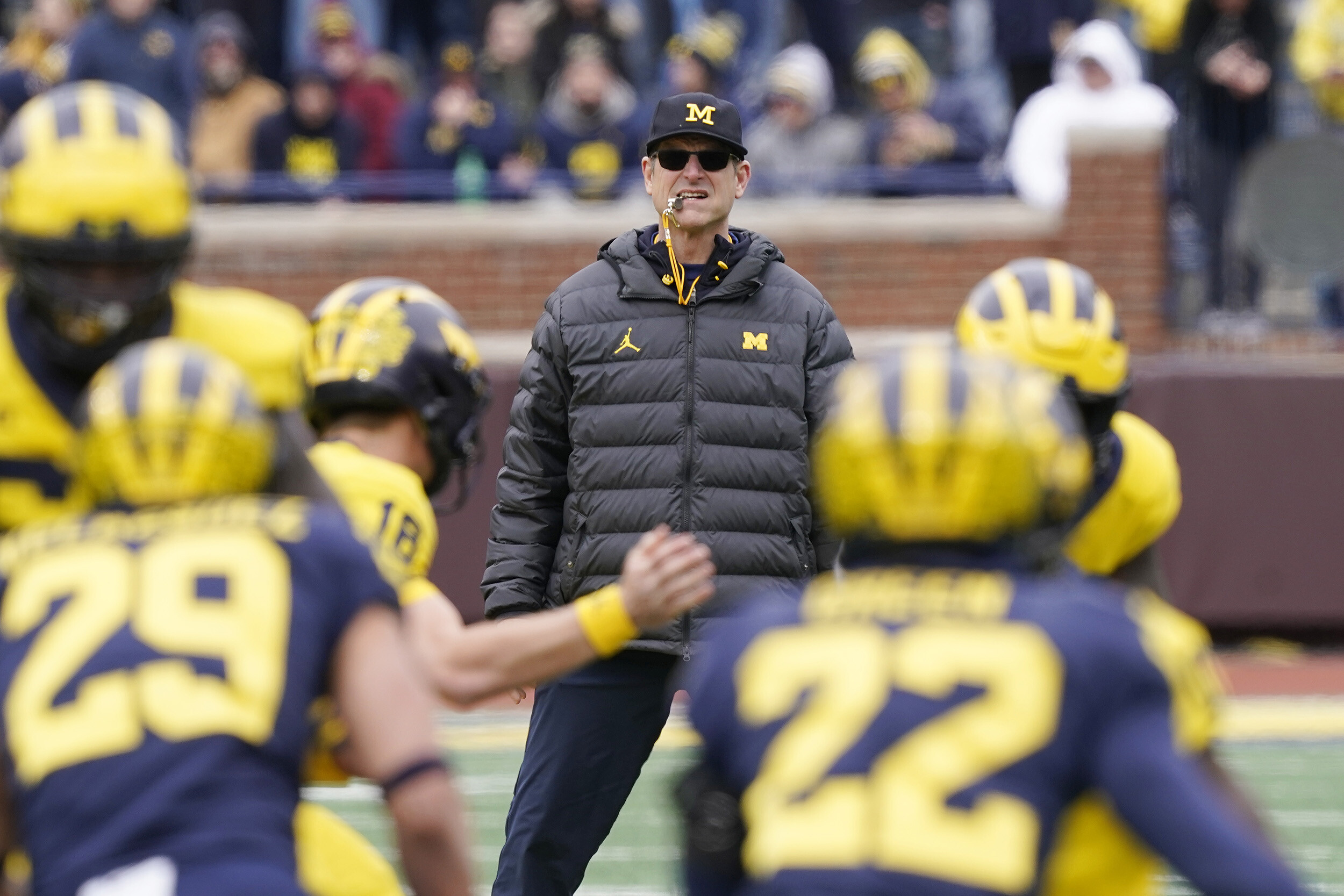 Harbaugh watches on during an intra-squad spring game.